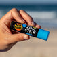 Sun Zapper Blue Zinc Stick in hand at beach, Sun Zapper Zinc Sticks, Dunedin New Zealand
