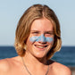 Sun Zapper Blue Zinc Stick on boy at beach, Sun Zapper Zinc Sticks, Dunedin New Zealand