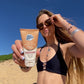 Sun Zapper Medium-Dark tinted Moisturiser SPF50 with woman at beach, Sun Zappaer Zinc Sticks, Dunedin New Zealand