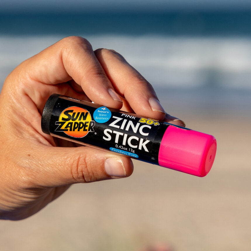 Sun Zapper Pink Zinc Stick in hand at beach, Sun Zapper Zinc Sticks, Dunedin New Zealand